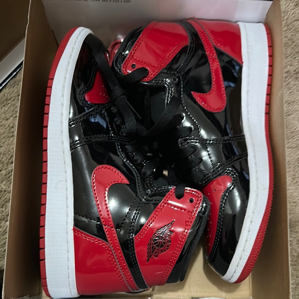 Bold Black and Red High-Top Sneakers with Glossy Finish